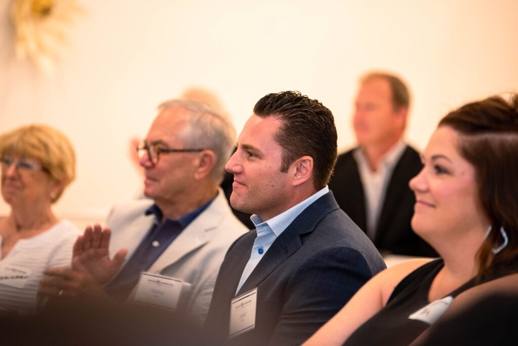 Attentive guests listen closely during a Severn Leadership Group Fellows graduation event in Annapolis