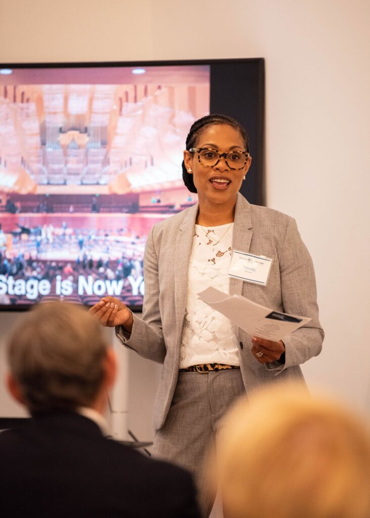 Fellow speaks to the audience during a Severn Leadership Group graduation in Annapolis