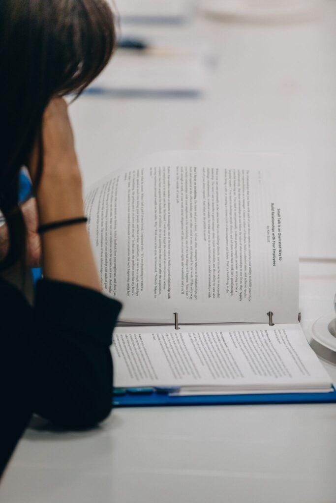 Fellow reads through printed program materials during a Severn Leadership Group leadership session